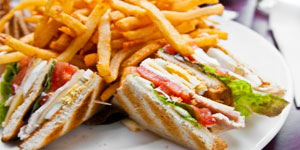 Sandwhich on plate with french fries